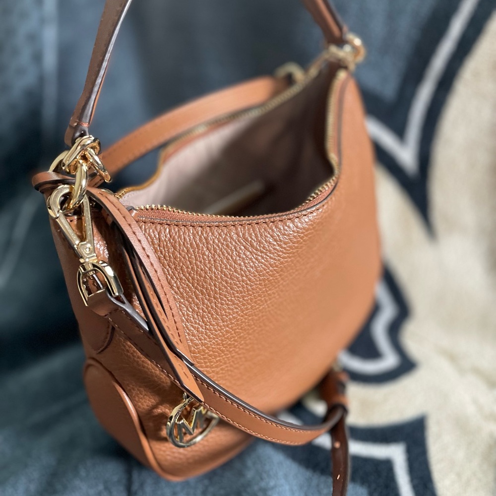 The Kelsey monogram small pouchette by Micheal Kors